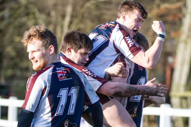 Ben Martin is mobbed after touching down