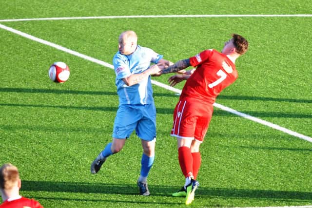 Jamie Forrester battles away