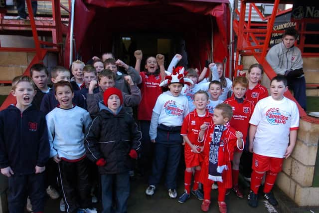 The mascots of both sides pose for the camera before kick-off