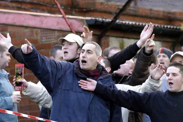 York City fans direct some verbals at the Cowshed