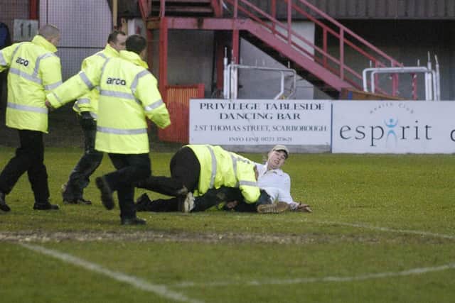 A York pitch invader is sent tumbling