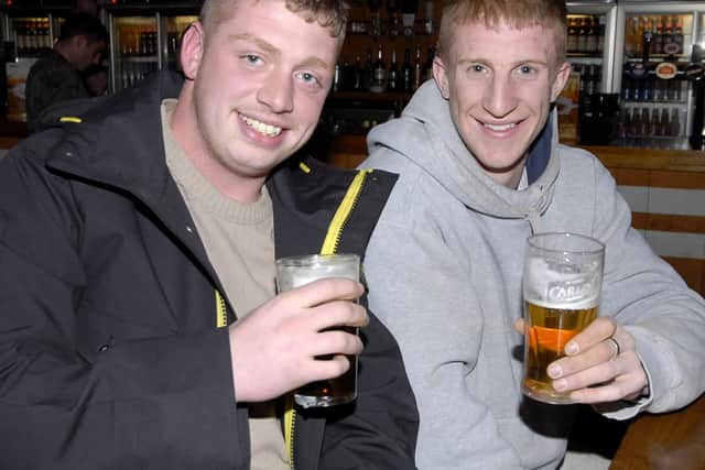 Will, of Old Town, enjoys an afterwork drink with Mikey, from town.