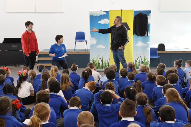 Pupils enjoying a performance in the new hall.