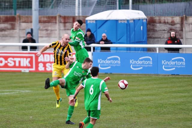 Ross Killock wins a header