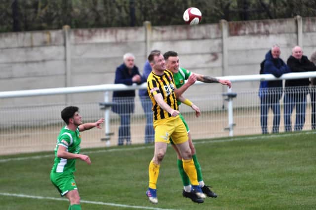 James Walshaw gets up for a header