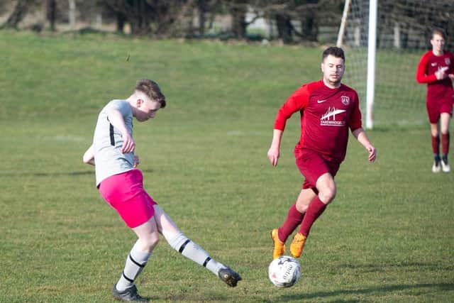 Saints FC on the ball in their 2-0 defeat at Angel Reserves