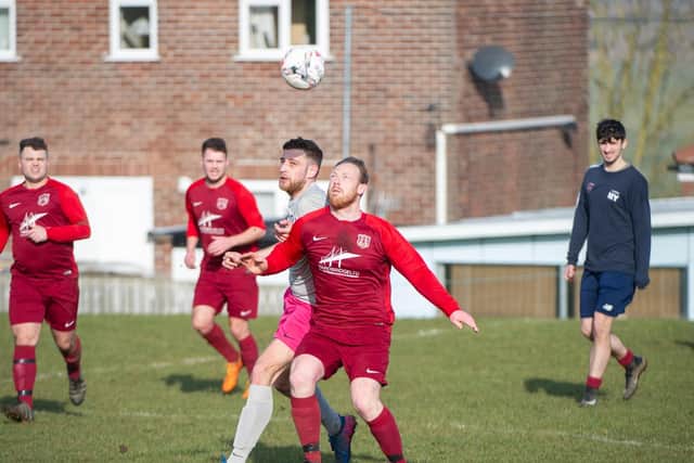 Angel Reserves and Saints battle for the ball