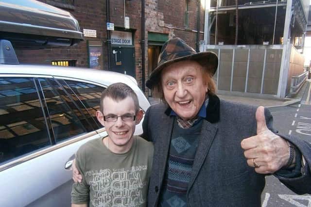The legendary comedian poses with Jed.