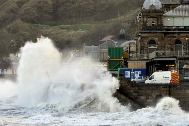 Waves crash against the sea wall at the Spa.