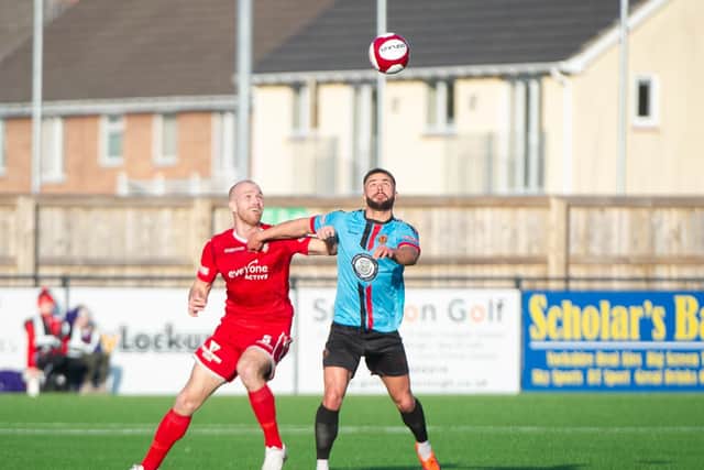 Ross Killock tussles with a Mickleover man