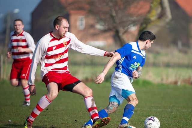 Traf's Sam Garnett on the ball