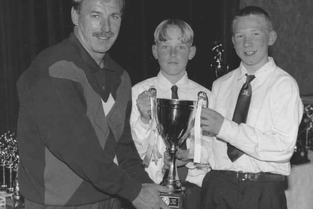Scarborough FC manager Ray McHale presented the trophy to the under 12s cup winners from Eastfield Football Club in 1995 - pictured from left to right, Glen Gibson and Adam Drury.