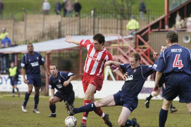 Tony Hackworth tries to fend off a York City man