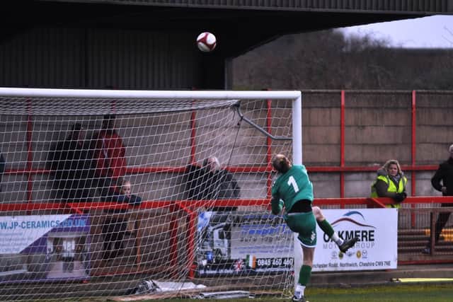 Keeper Greg Hall tips the ball over