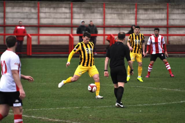 Matty Dixon feeds the ball forward
