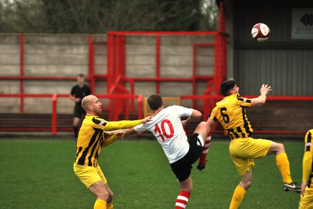 Ross Killock and James Williamson battle for the ball