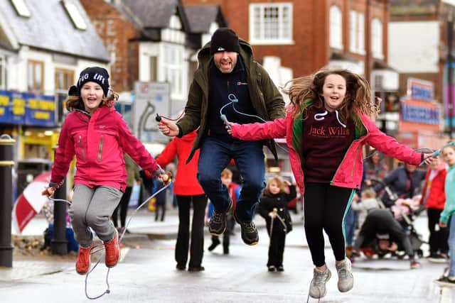 Eleanor and Loretta Nolan challenge Dad Ben to a 'skip off'. Picture: Richard Ponter