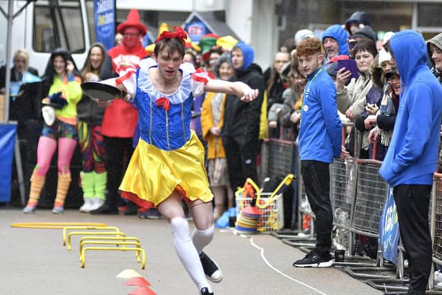 Snow White proves unbeatable in the Pancake Races. Picture: Richard Ponter