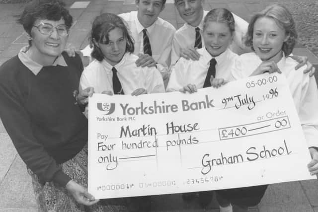 In 1996, secretary of the Scarborough branch of the Friends of Martin House Hospice for Children, Margaret Pearson, left, received a cheque from Graham School pupils who had been fundraising for the charity, from left, Joanne Appleby, Shane Auckland, Adam Sheader, helen Bays, Lindsay Barrett.
