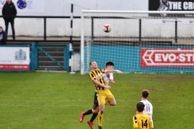 James Walshaw wins a header