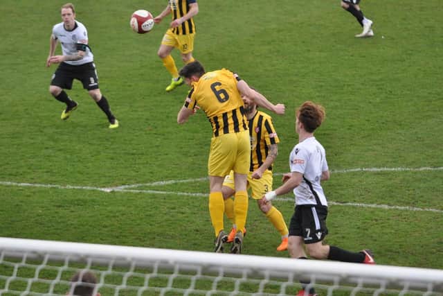 James Williamson wins a header