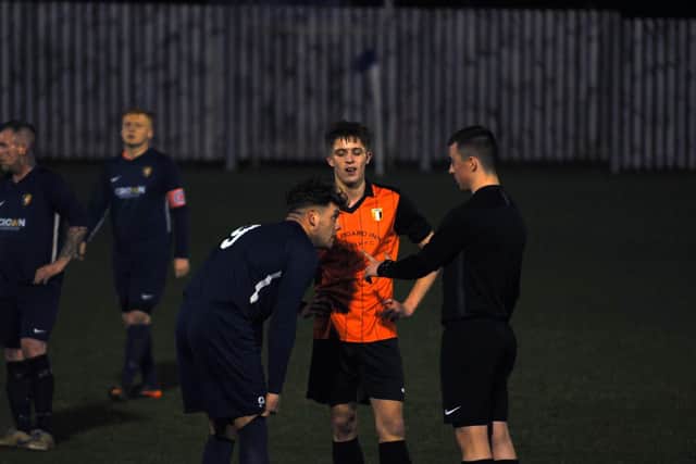 The ref tries to calm things down