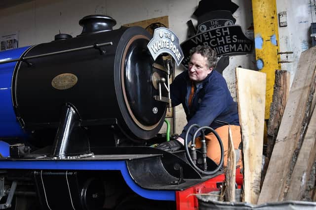 Volunteer Paul Stubbins helps keep the engines looking gleaming