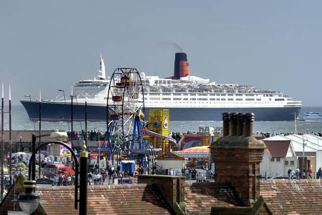 Our main image shows the Regal Lady and Hispaniola. This image shows the Regal Lady dwarfed by the QE2 as it sailed past in 2007.