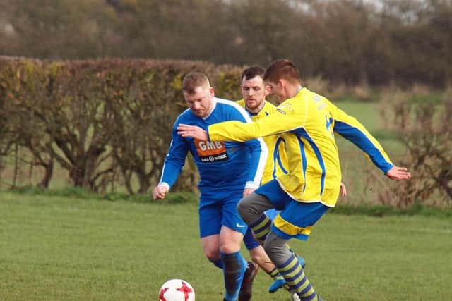 Ayton's James Cooke battles for the ball