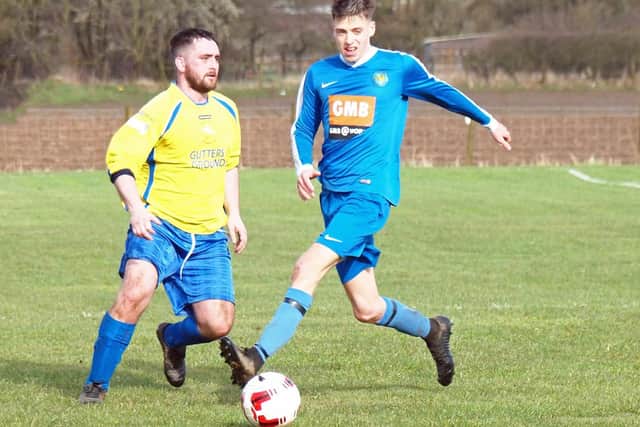 Ayton and Eastfield battle for the ball