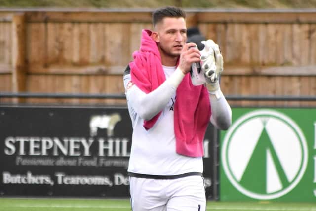 Tommy Taylor applauds the fans