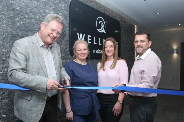 Stefan Anselm, Alpamare director, Amanda Shachnaey, spa manager, Vicki Jones, operations manager and John Kirchner-Waines, restaurant manager, cut the ribbon to open Wellness at Alpamare.