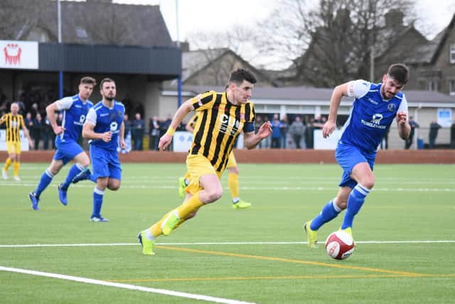 Michael Coulson charges into the box