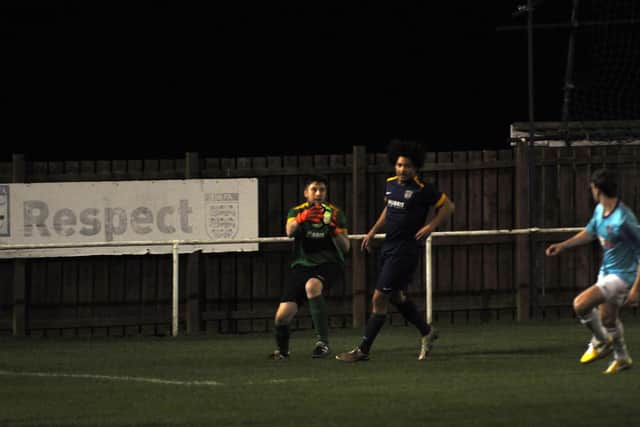 Keeper Joe Wright claims the ball