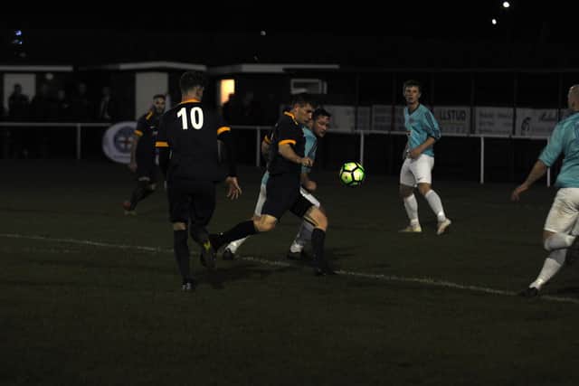 Angel fire a shot at goal
