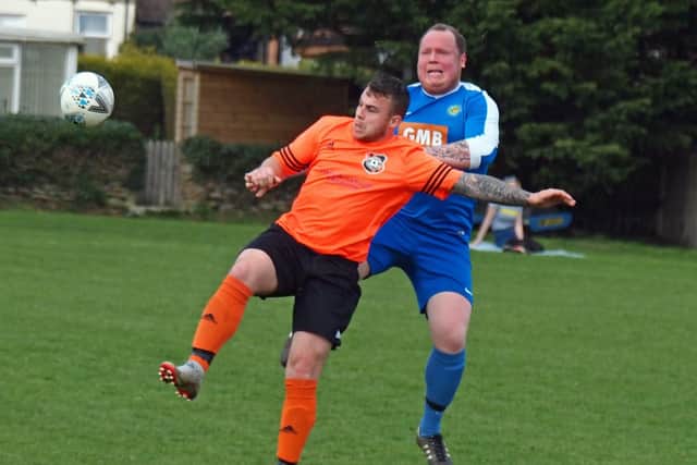 Howard Dickinson gets to grips with a Snainton player