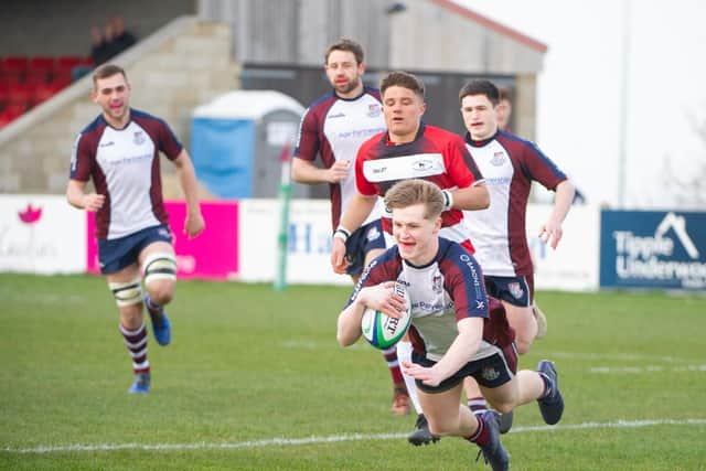 Euan Govier dives over the whitewash