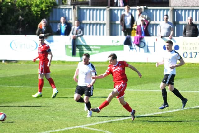 Luke Lofts has a crack at goal