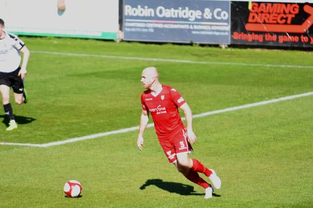 Ross Killock looks to pick a pass