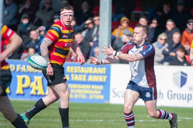 Jordan Wakeham moves the ball on