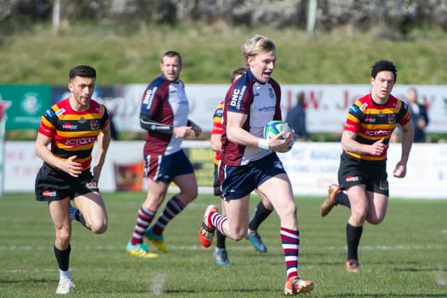 Aaron Wilson charges away from chasing Bradford opponents