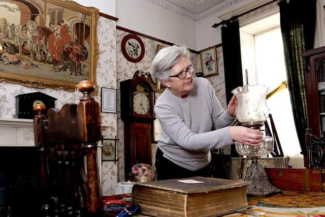 Volunteer Liz Whitehouse in the Victorian parlour