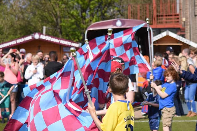 Flags are waved before the players make their entrance