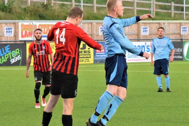 Pier defender Jake Adams and Seamer's Danny Glendinning