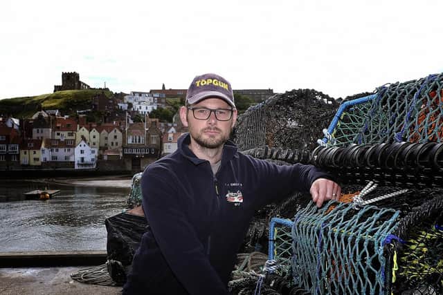 Skipper Craig Locker with lobster pots. PIC: Richard Ponter