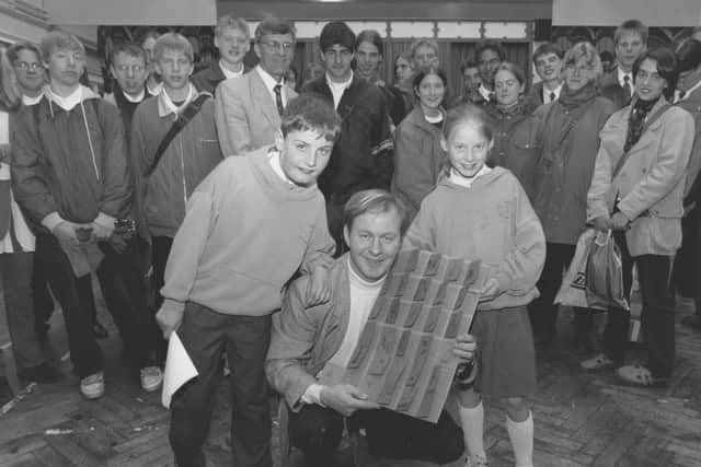 The school band from Skelleftea in northern Sweden visited Scarborough for four days and played at Gladstone Road Junior School in May 1996. 
Pictured are pupils David Flinton and Michaela Dennis, who, along with the rest of Class 4K, presented a giant thank you card to the bands conductor Thomas Oestlund, centre