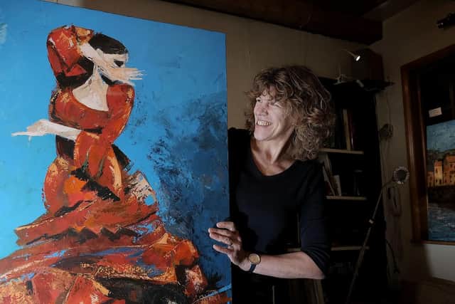 Artist Heather Burton with a piece of her work.
194425a