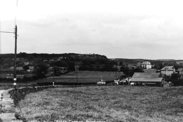 Taken from Burniston High Street, this view looking towards Cloughton shows the curve of Mill Lane as bends awy into the distance. The bend is know locally known as Tidds Corner.Tidds Corner is on Scarborough and District and Arriva bus routes and appears on their respective timetables.Photo reproduced courtesy of the Max Payne collection. Reprints can be ordered with proceeds going to local charities. Telephone 0330 1230203 and quote reference number