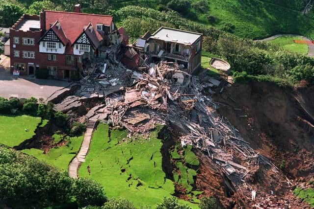 File photo dated 8/6/1993 of the scene at the Holbeck Hall Hotel in Scarborough, North Yorks, after a massive landslip. A local authority was today cleared of causing the destruction of the 120-year-old luxury Victorian hotel which collapsed 150ft down a cliff face to the beach below. A High Court judge ruled in 1997 that Scarborough Council had breached its duty of care but the Court of Appeal overruled the decision, Tuesday February 22, 2000. See PA story COURTS Hotel. PA photo: John Giles.