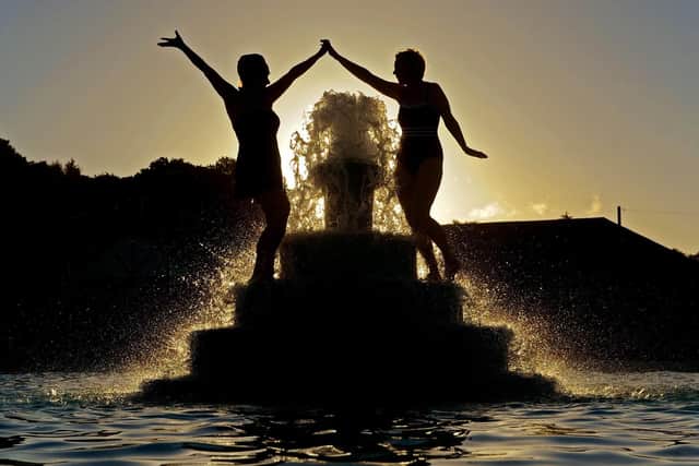 Swimmers Joanne Crowther and Alla Horoshenkova at Ilkley Lido celebrate the summer soltice by having a dip at sunrise. Picture Tony Johnson.
